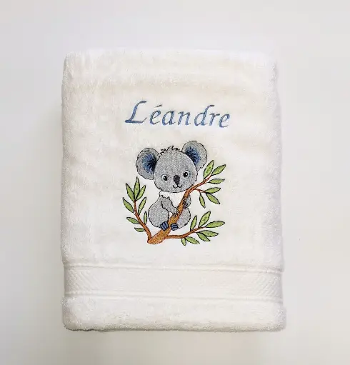 Motif koala sur la branche brodé sur linge de bain au choix